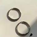 Macro shot of silver inside-out hoop earrings with micro-pave cubic zirconia stones - Silver Large Zirconia Earrings