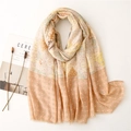 Detailed flat lay of soft cotton linen scarf with ethnic patterns and frayed edges - Khaki