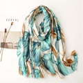 Tropical leaf print cotton linen shawl with fringe on a minimalist white background - Cyan-Blue Tulip (SL2105-020 Blue)