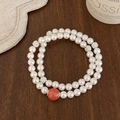 Elegante bracciale a doppio strato di perle con sfere di cristallo su legno - Bianco