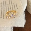 Bague dorée ajustable avec cinq fleurs en émail violet et centres en zircons - Violet