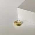 Detailed view of the irregular lava texture on the gold adjustable minimalist ring - C-27 Gold Glossy (Lava Wave Style)