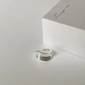 Macro shot of silver wave ring featuring a minimalist irregular mirror finish design - C-27 Silver Glossy (Lava Wave Style)