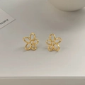 Detailed view of elegant gold hollow flower stud earrings with a polished metallic finish - Gold