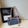 Blue leopard print tote bag with pink trim in a minimalist fashion studio setting - Blue