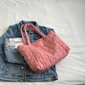 Pink quilted space cotton tote bag with grid stitching on denim jacket background - Pink