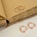 Detail of rose gold hoop earrings set including a polished pair and one with micro-pave zircons - Rose Gold 4-Piece Hoop Earring Set