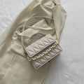 Quilted crossbody bag in beige with decorative resin chain and adjustable strap - White