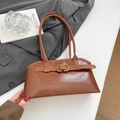 Vintage brown glossy leather shoulder bag with buckle detail on a grey blazer suit - Dark Brown