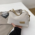 Chic cream knit crossbody bag with brown leather trim and golden metal hardware - Khaki