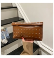 Detailed view of a vintage brown envelope clutch bag with silver metallic stud accents - Brown