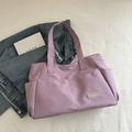 Minimalist lavender nylon tote bag with multi-pocket design for daily commuting - Purple