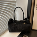 Retro large capacity black suede tote bag with metal buckle strap on a window sill - Black