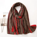 Detail of red and black geometric diamond pattern scarf with vintage Greek key border - Red