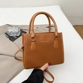 Brown litchi grain faux leather tote bag with gold lettering and adjustable strap - Brown