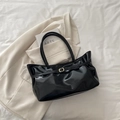 Minimalist black shiny faux leather tote bag with elegant gold metal buckle detail - Black