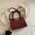 Retro burgundy frosted faux suede handbag with a metallic gold clasp and top handle - Red
