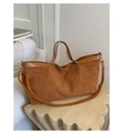Detail of brown faux suede tote bag with leather piping and adjustable shoulder strap - Brown