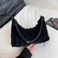 Black plush shoulder bag with vertical pleats and golden metal hardware details - Black