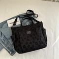 Borsa tote jacquard nera con motivi floreali e tracolla in nylon regolabile - Nero