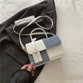 Blue denim and white leather patchwork crossbody bag with elegant gold hardware and top handle - White