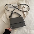 Chic dark grey patent leather handbag in trapezoid shape with golden hardware - Gray