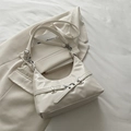 Minimalist cream white crescent hobo bag with silver buckle and eyelet strap details - White