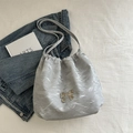 Silver glossy pleated backpack with metallic bow detail and drawstring closure - Silver