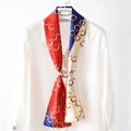 Color-block skinny silk scarf with vintage rings pattern tied on a white shirt - Red