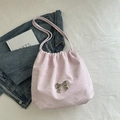 Pink pleated fabric tote bag with a metallic silver bow accent and matching shoulder strap - Pink