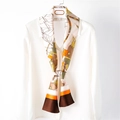French style anchor chain printed silk twilly scarf tied on a white shirt collar - Orange