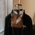 Glossy brown bucket bag with silver chain handle and drawstring closure in leather - Brown / No Pendant