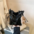Black patent leather bucket bag with silver chain strap and brown bear charm detail - Black / With Pendant