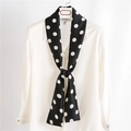 Elegant black skinny scarf with white polka dots tied on a white shirt collar - Black with White Polka Dots