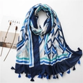 Bohemian geometric kaleidoscope scarf with tassel edges on a minimalist background - Blue