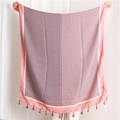 Pink cotton-linen scarf with diamond pattern and tassel trim shown in full view - Pink