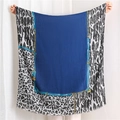 Detail of large silk scarf featuring leopard prints, gold chains and royal blue center - Blue