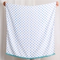 Detailed view of white polka dot bath towel with blue dots and green pompom fringe edge - 180*90CM / Blue Polka Dot