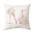 White square cushion cover with floral letter M print in a modern minimalist home style - Style M