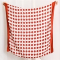 Detail of a large square scarf featuring classic red and white polka dots and a wide red border - Orange