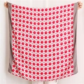 Detail of red polka dot scarf with white grid pattern and gray border edges - Red