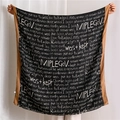 Detail of soft black scarf featuring white cursive text print and caramel brown hem - 180x90cm / Black (SL1910-028 Black)