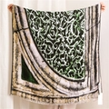Close-up of geometric pattern and fine fringe on cotton linen vintage shawl - Dark Green