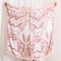 Detail of bohemian scarf with paisley prints and white pom-pom fringe trim - Khaki