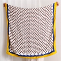 Detail of floral linen scarf featuring red flower patterns and navy wavy border trim - Yellow (SL1905-009)
