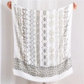 Detail of bohemian cotton linen scarf with golden patterns and raw fringe edges - Black