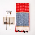 Flat lay of a multicolor geometric pattern shawl with tassels and dried lotus pods - Red (SL1908-013)