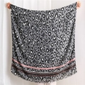 Detail view of leopard print scarf with striped border and delicate fringe edges - Black (SL1908-033)