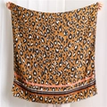 Close-up of leopard print shawl featuring color-block stripes and delicate frayed edges - Orange (SL1908-033)