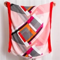 Close-up of geometric print scarf showing soft pink fabric and delicate frayed edges - 180*90CM / Red
